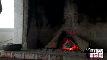 Big tits teen strips off by the hearth