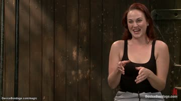 Redhead in back arch bondage toyed