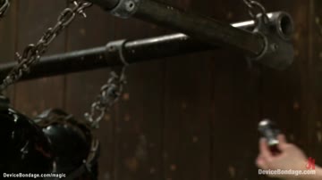 Lesbian in latex suspension spanked