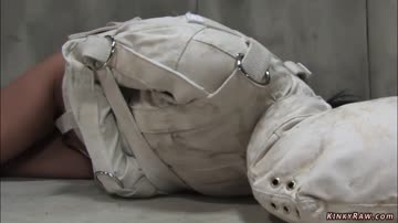 Brunette psycho bound in straitjacket