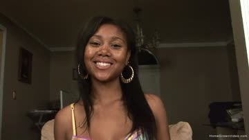 Thin black babe masturbates with a big purple toy