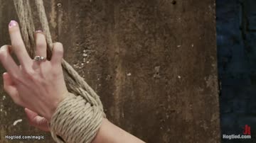 Blonde slave suffers hogtie suspension