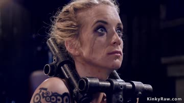Shackled blonde slave gets whipped