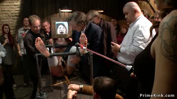 Shackled redhead is toyed in public