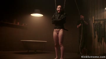Gagged brunette in straitjacket bound