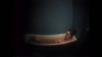 Busty mother masturbates in bath