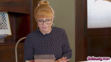 Karla glances under the table and notices Jay pleasuring Penny