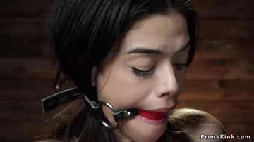 Gagged petite slave is tormented