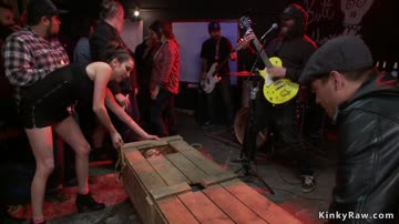 Chained slave fucked at public concert