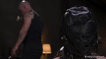 Sub in leather mask hung upside down