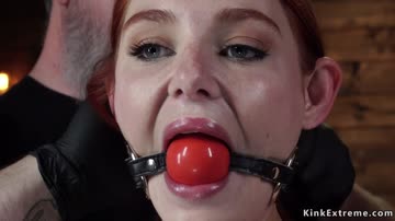 Gagged redhead tormented in hogtie