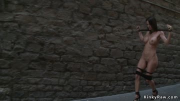Shackled naked slut posing in public