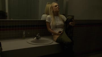2 girls & a guy in a public toilet.